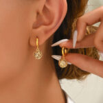Elegant Gold Tone Dangle Earrings with CZ Heart Pattern
