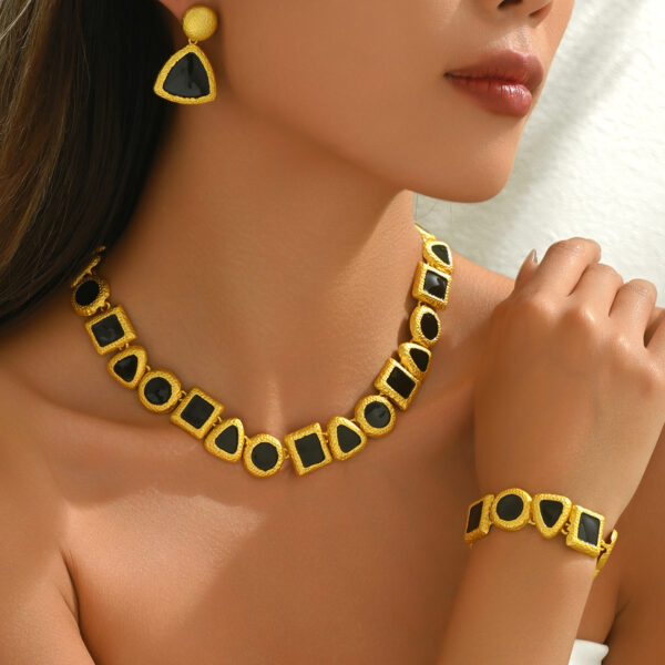 gold-tone_geometric_earrings,_necklace_&_bracelet_set_with_black_enamel_image_1