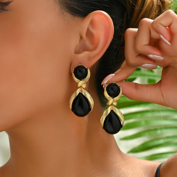 gold_tone_copper_dangle_earrings_with_black_geometric_stones_image_1