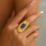 Gold Tone Oval Open Ring with Blue Crystal